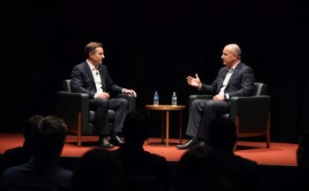 Two professionals in a panel discussion on a dimly lit stage